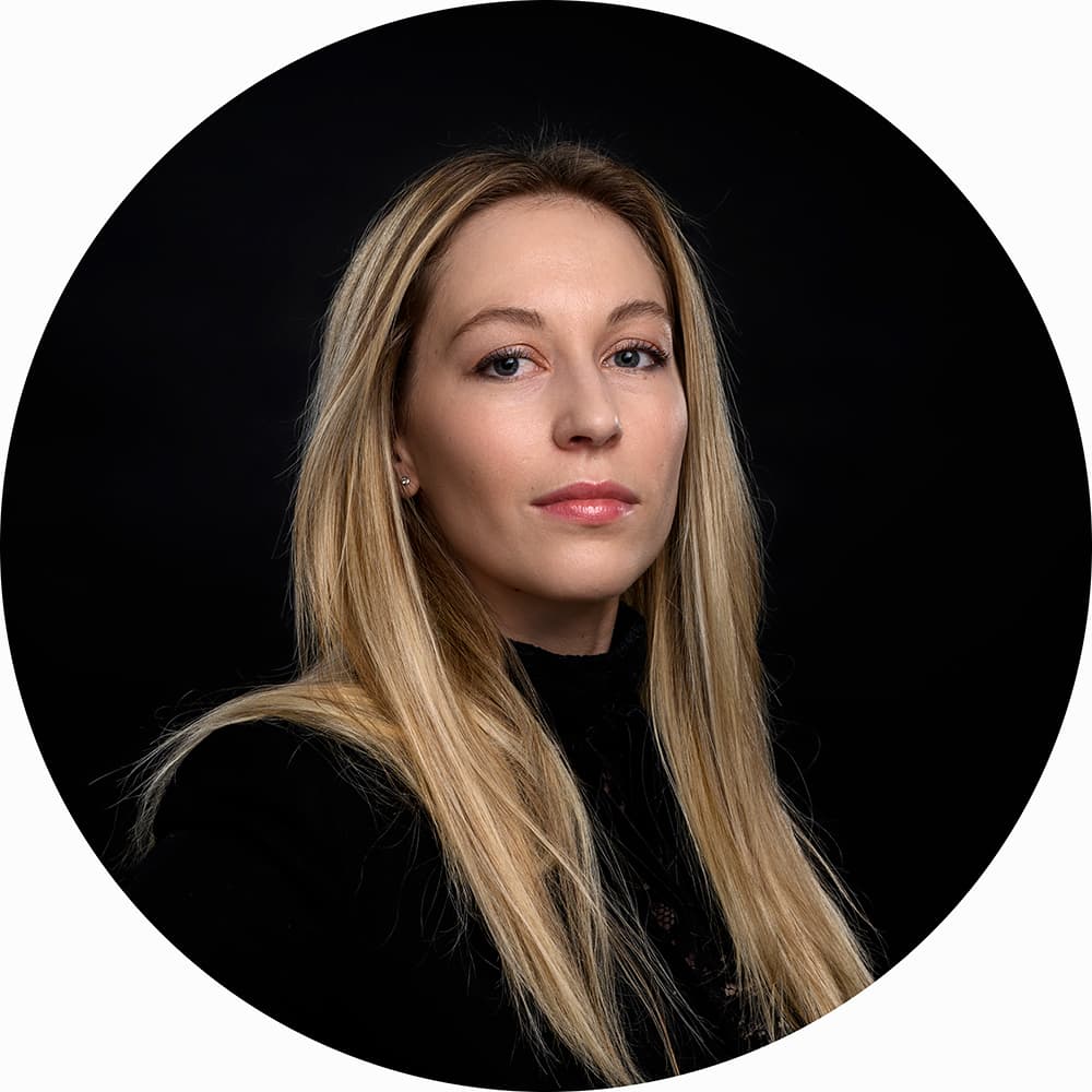 Elisa's LinkedIn Headshot on a Black Background