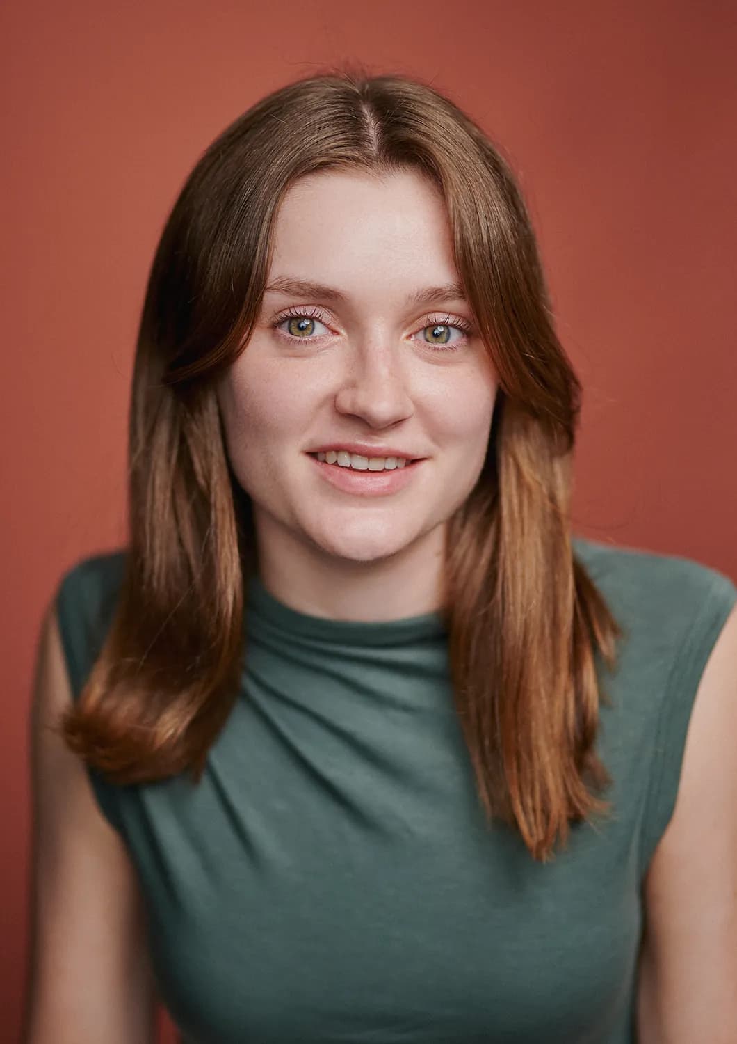 Choose clothing colours that complement your eyes to make them pop in your headshots